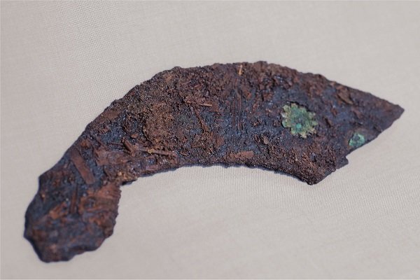 Fragment of an iron scabbard with copper embellishment