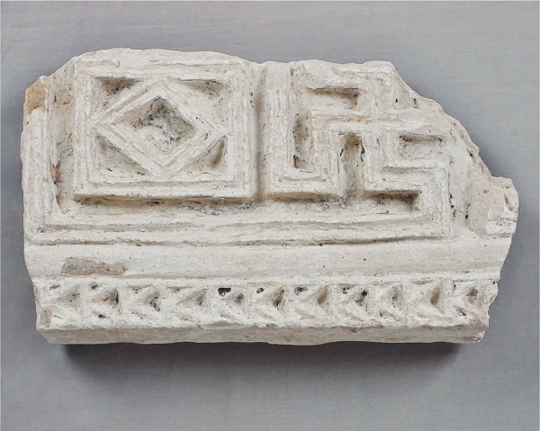 Carved stucco fragment